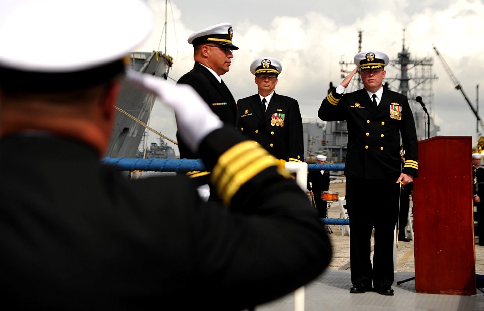 Flickr - Official U.S. Navy Imagery - Cmdr. Richard Meyer salutes during the decommissioning of USS John L. Hall.