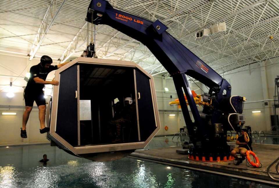 Flickr - Official U.S. Navy Imagery - Marines as they are lowered into a pool underwater egress training.