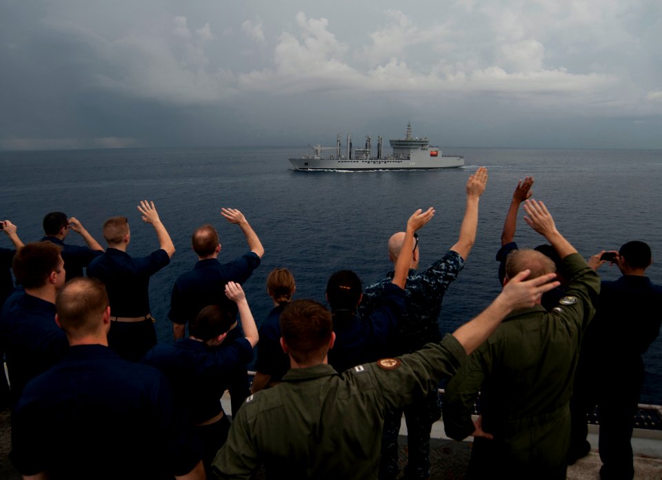 Flickr - Official U.S. Navy Imagery - Carl Vinson Sailors wave at passing INS Satpura.