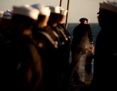 Flickr - Official U.S. Navy Imagery - Chaplain Lt. Gregory Hazlett commits cremated remains to the sea.