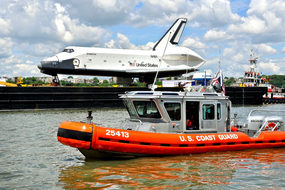 Flickr - Official U.S. Navy Imagery - Coast Guard boat crew from Station New York enforces a safety zone around a barge carrying the retired space shuttle Enterprise.