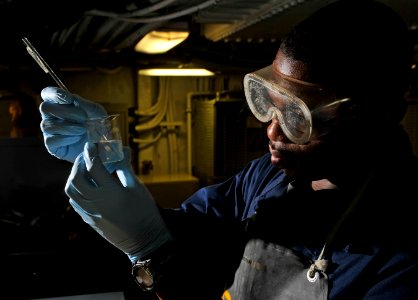 Flickr - Official U.S. Navy Imagery - Navy machinist runs test for diesel generator.
