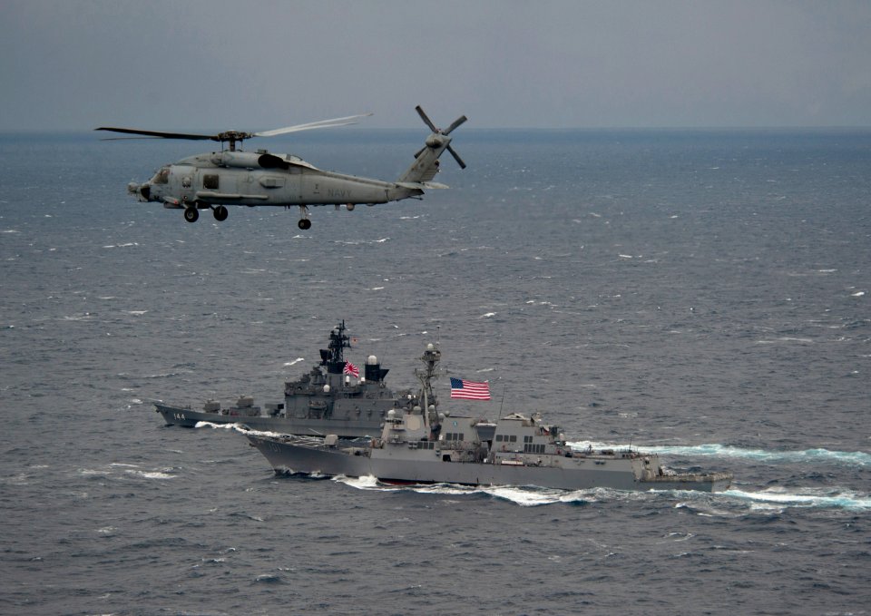 Flickr - Official U.S. Navy Imagery - Navy Sea Hawk flies above US and Japanese ships.