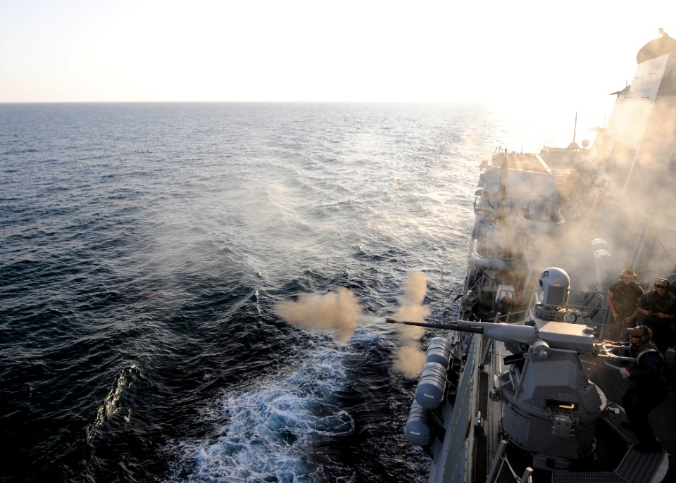 Flickr - Official U.S. Navy Imagery - Gunners Mate 1st Class Shane Howard fires a MK-38 machine gun system during a live-fire exercise aboard the Arleigh Burke-class guided-missile destroyer USS Momsen.