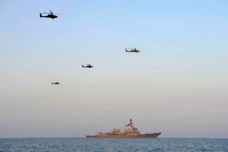 Flickr - Official U.S. Navy Imagery - Helicopters fly over USS Jason Dunham.