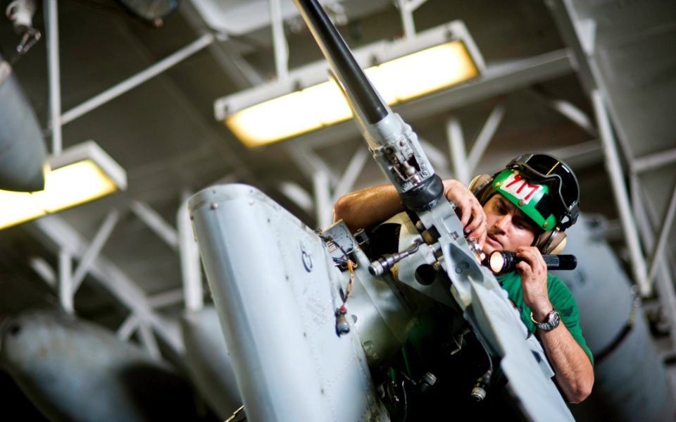 Flickr - Official U.S. Navy Imagery - inspects the tail rotor of a helicopter.