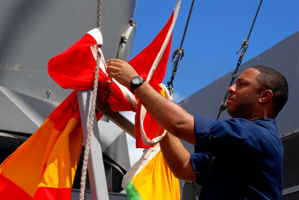 Flickr - Official U.S. Navy Imagery - Sailor bring down the Romeo flag.