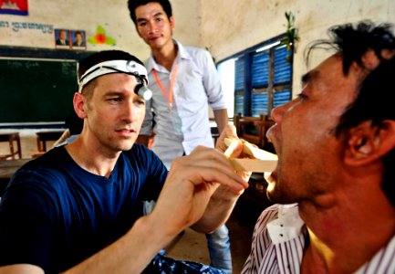 Flickr - Official U.S. Navy Imagery - Lt. Cmdr. Curtis Gaball checks the airway of a Cambodian man.