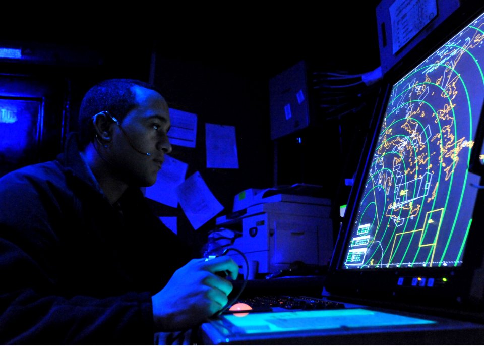Flickr - Official U.S. Navy Imagery - Sailor controls aircraft during flight operations.