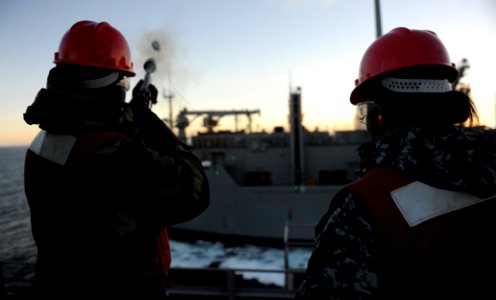 Flickr - Official U.S. Navy Imagery - Sailor fires a line from USS John C. Stennis to USNS Charles Drew.