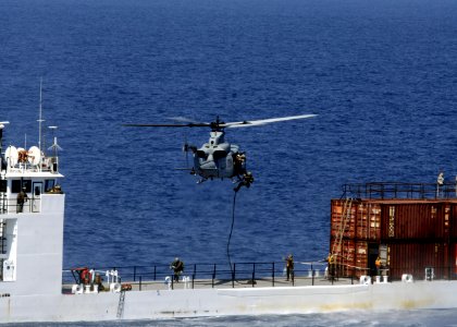 Flickr - Official U.S. Navy Imagery - Marines rappel out of a helicopter.