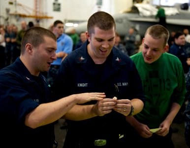 Flickr - Official U.S. Navy Imagery - Sailor holds a Super Bowl ring during autograph signing session.