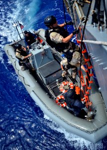 Flickr - Official U.S. Navy Imagery - Members of the visit, board, search and seizure team prepare to maneuver alongside USS Porter during a training mission. (1)