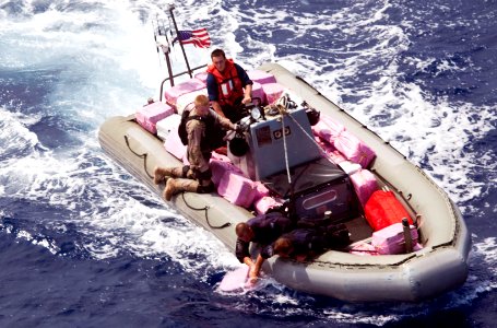 Flickr - Official U.S. Navy Imagery - Navy and Coast Guard personnel pick up bales of narcotics during recovery operations in the Caribbean Sea. (2)