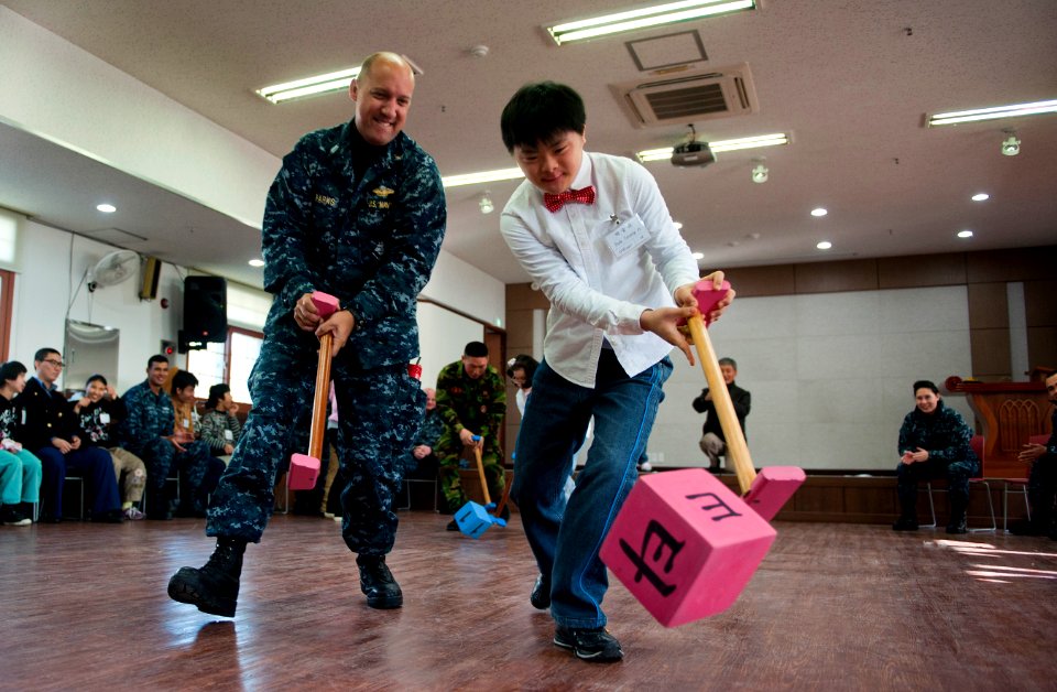 Flickr - Official U.S. Navy Imagery - Sailor plays a game at a Korean home for handicapped children.
