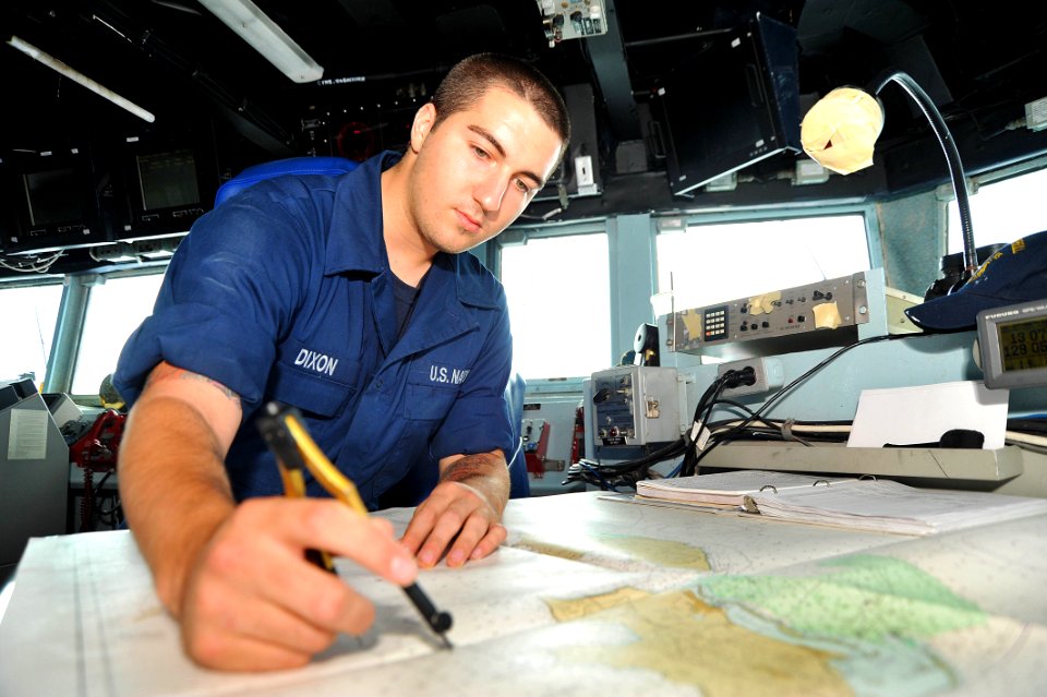 Flickr - Official U.S. Navy Imagery - Sailor plots on a chart.