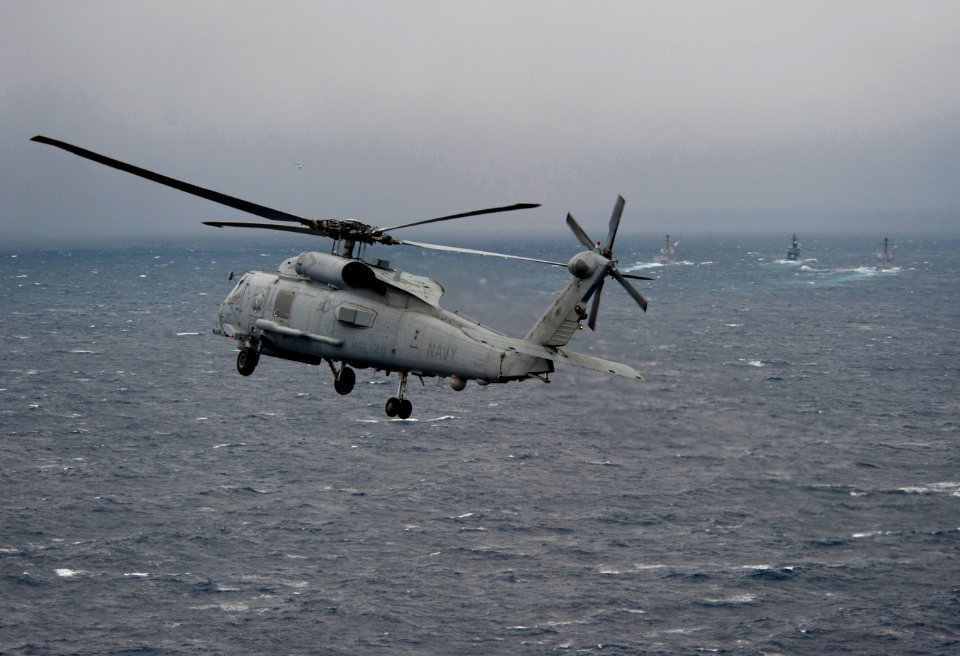 Flickr - Official U.S. Navy Imagery - Navy Sea Hawk approaches three-ship formation.