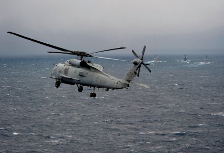 Flickr - Official U.S. Navy Imagery - Navy Sea Hawk approaches three-ship formation.