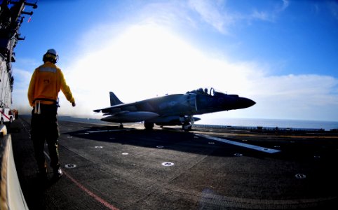Flickr - Official U.S. Navy Imagery - Sailor signals all clear to an AV-8 Harrier before it takes off from the flight deck aboard USS Boxer