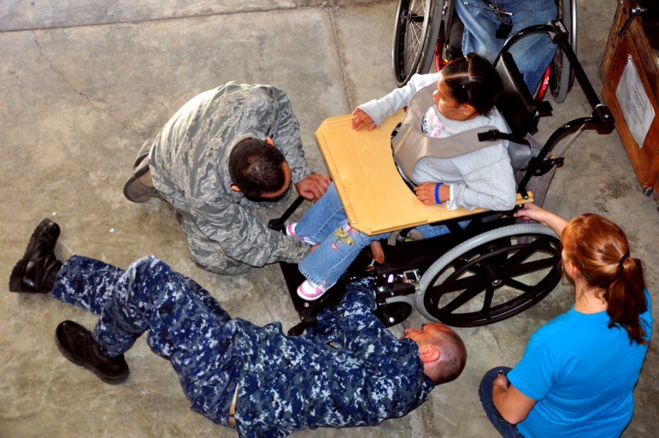 Flickr - Official U.S. Navy Imagery - Officers from Southern Partnership Station 2012 adjust a wheelchair.