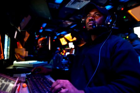 Flickr - Official U.S. Navy Imagery - Operations Specialist Seaman Andre Brown mans a console in the Combat Information Center of the Ticonderoga-class guided-missile cruiser USS Cape St. George.