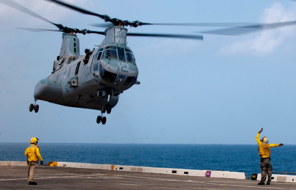 Flickr - Official U.S. Navy Imagery - Sailor's guide a helicopter on to the flight deck.