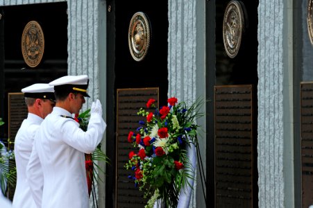 Flickr - Official U.S. Navy Imagery - Officers salute the EOD Memorial wall.