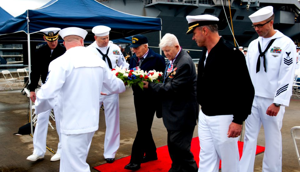 Flickr - Official U.S. Navy Imagery - Sailors along with Battle of Midway veterans carry a wreath during a Battle of Midway commemoration ceremony on a pier at Naval Base Kitsap.