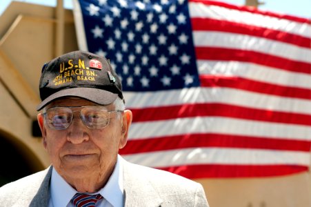 Flickr - Official U.S. Navy Imagery - Retired Hospital Apprentice 1st Class Frank H. Walden answers questions from local media about his actions on D-Day.