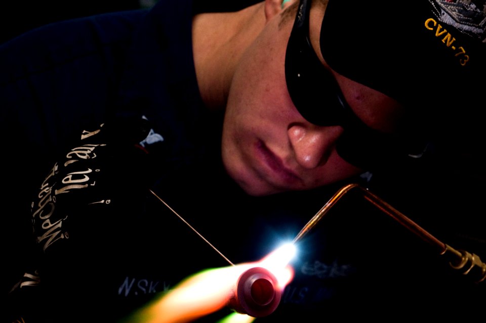 Flickr - Official U.S. Navy Imagery - Sailor brazes a low pressure air line valve fitting.