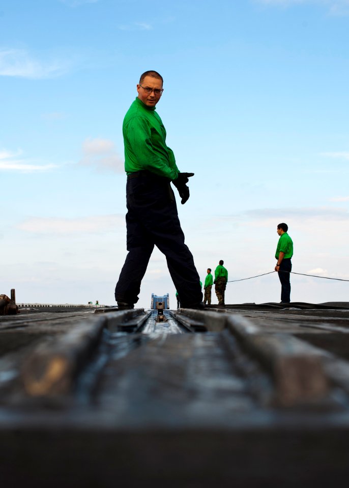 Flickr - Official U.S. Navy Imagery - Sailor checks steam catapult.