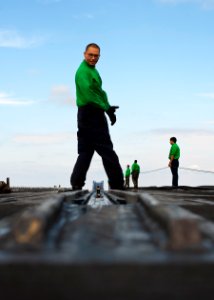 Flickr - Official U.S. Navy Imagery - Sailor checks steam catapult.
