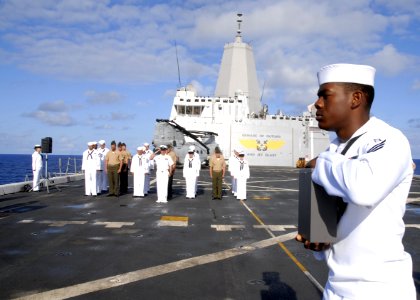 Flickr - Official U.S. Navy Imagery - Sailor carries remains during burial at sea.