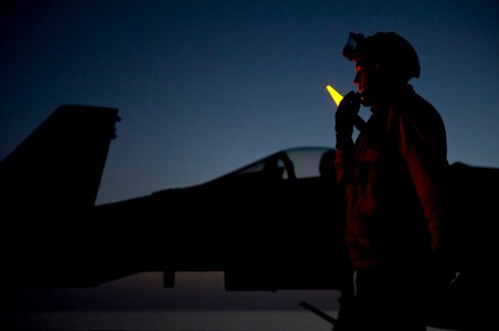Flickr - Official U.S. Navy Imagery - Sailor coordinates the movement of aircraft aboard USS Carl Vinson.