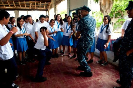 Flickr - Official U.S. Navy Imagery - Sailor dances with students in Saipan.