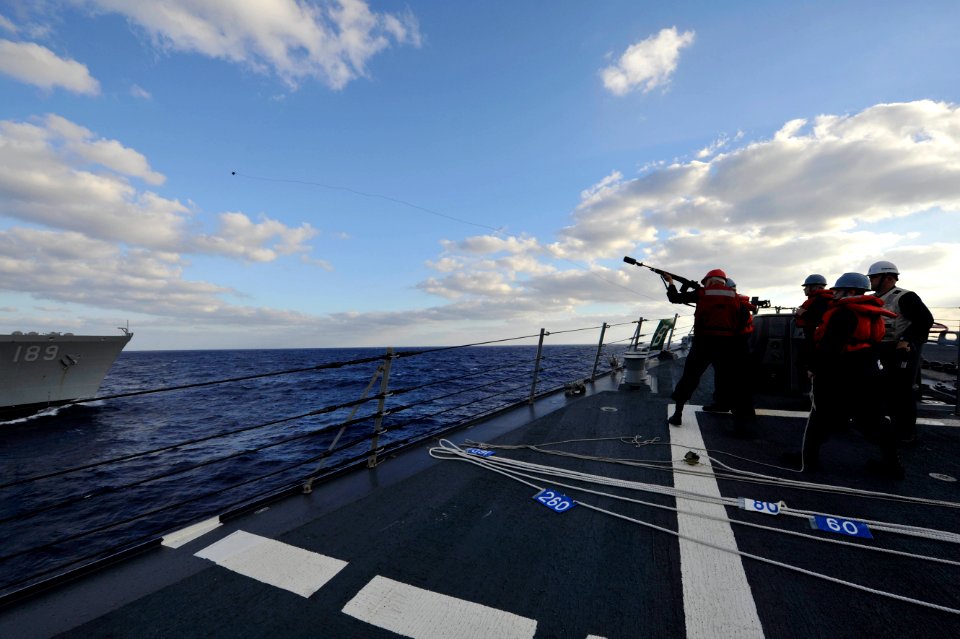 Flickr - Official U.S. Navy Imagery - Sailor fires line during replenishment at sea. (1)