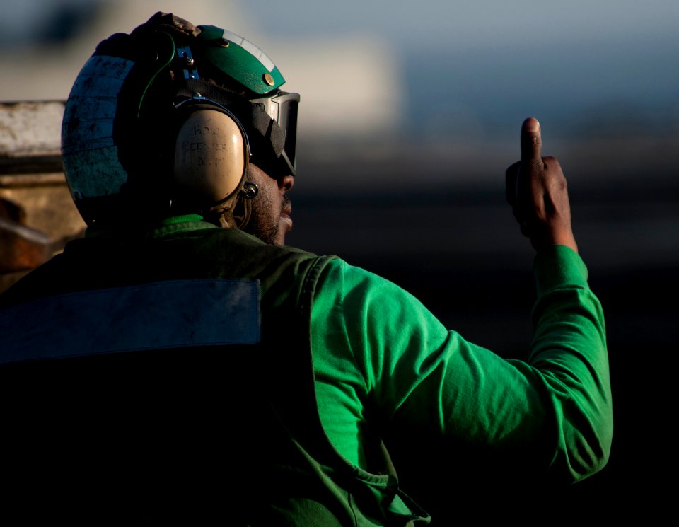 Flickr - Official U.S. Navy Imagery - Sailor gives a thumbs up while preparing bow catapults to launch aircraft.