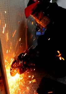 Flickr - Official U.S. Navy Imagery - Sailor cuts metal with circular saw.