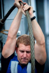 Flickr - Official U.S. Navy Imagery - Sailor holds cable during replenishment at sea evolution.