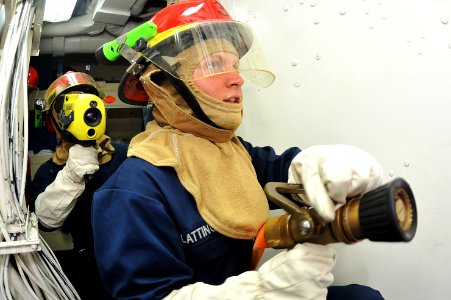 Flickr - Official U.S. Navy Imagery - Sailor fights a simulated fire.