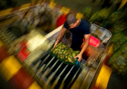 Flickr - Official U.S. Navy Imagery - Sailor loads potatoes onto a stores elevator after replenishment at sea.