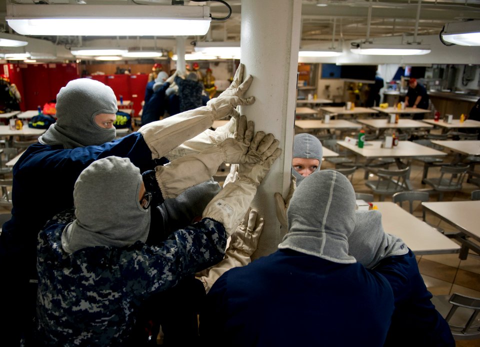 Flickr - Official U.S. Navy Imagery - Sailors brace for impact during training drill.