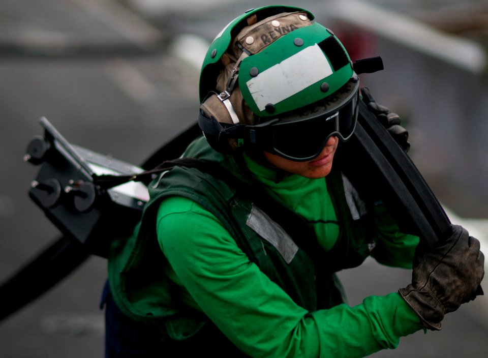 Flickr - Official U.S. Navy Imagery - Sailor moves equipment from USS Carl Vinson's catapults.