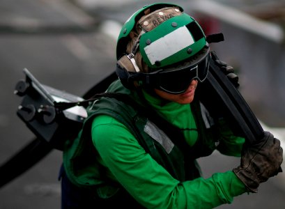Flickr - Official U.S. Navy Imagery - Sailor moves equipment from USS Carl Vinson's catapults.