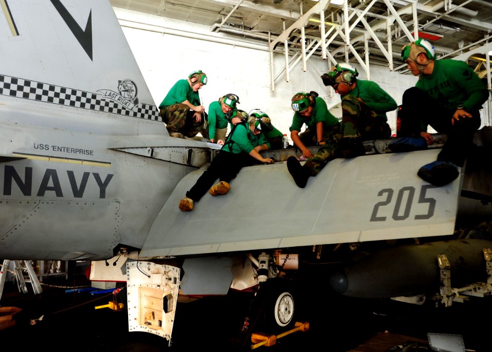 Flickr - Official U.S. Navy Imagery - Sailors check an F-A-18 Hornet for corrosion.