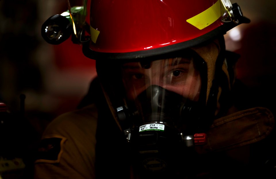 Flickr - Official U.S. Navy Imagery - Sailor observes firefighting procedures during drill.