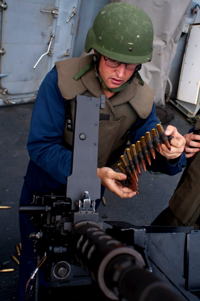 Flickr - Official U.S. Navy Imagery - Sailor loads .50-caliber machine gun.