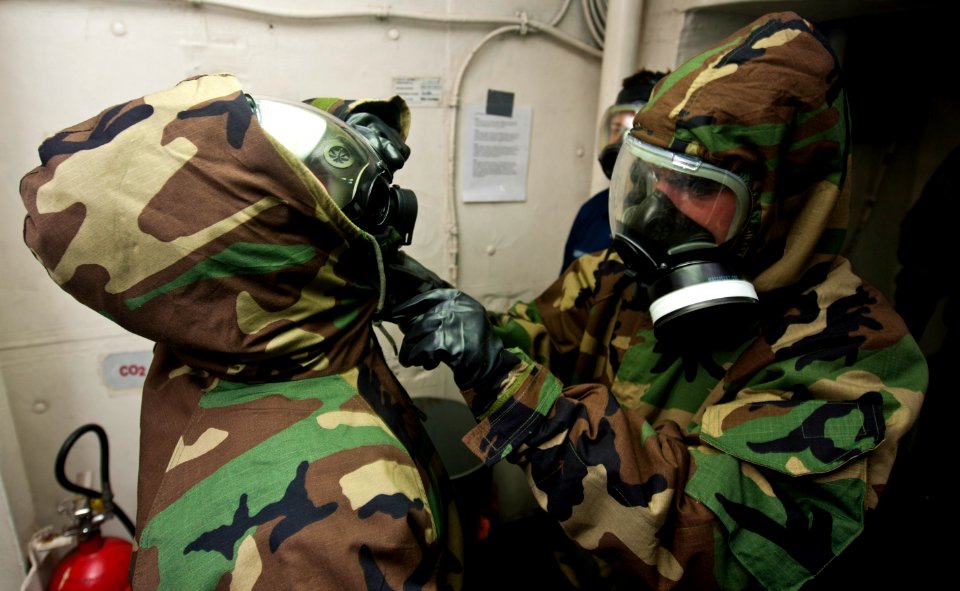 Flickr - Official U.S. Navy Imagery - Sailor removes protective gear.