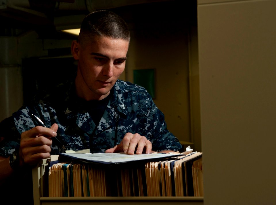 Flickr - Official U.S. Navy Imagery - Sailor reviews paperwork aboard USS Carl Vinson.
