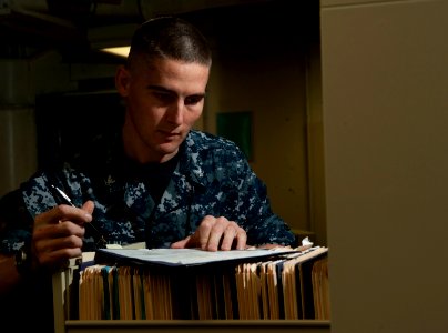 Flickr - Official U.S. Navy Imagery - Sailor reviews paperwork aboard USS Carl Vinson.